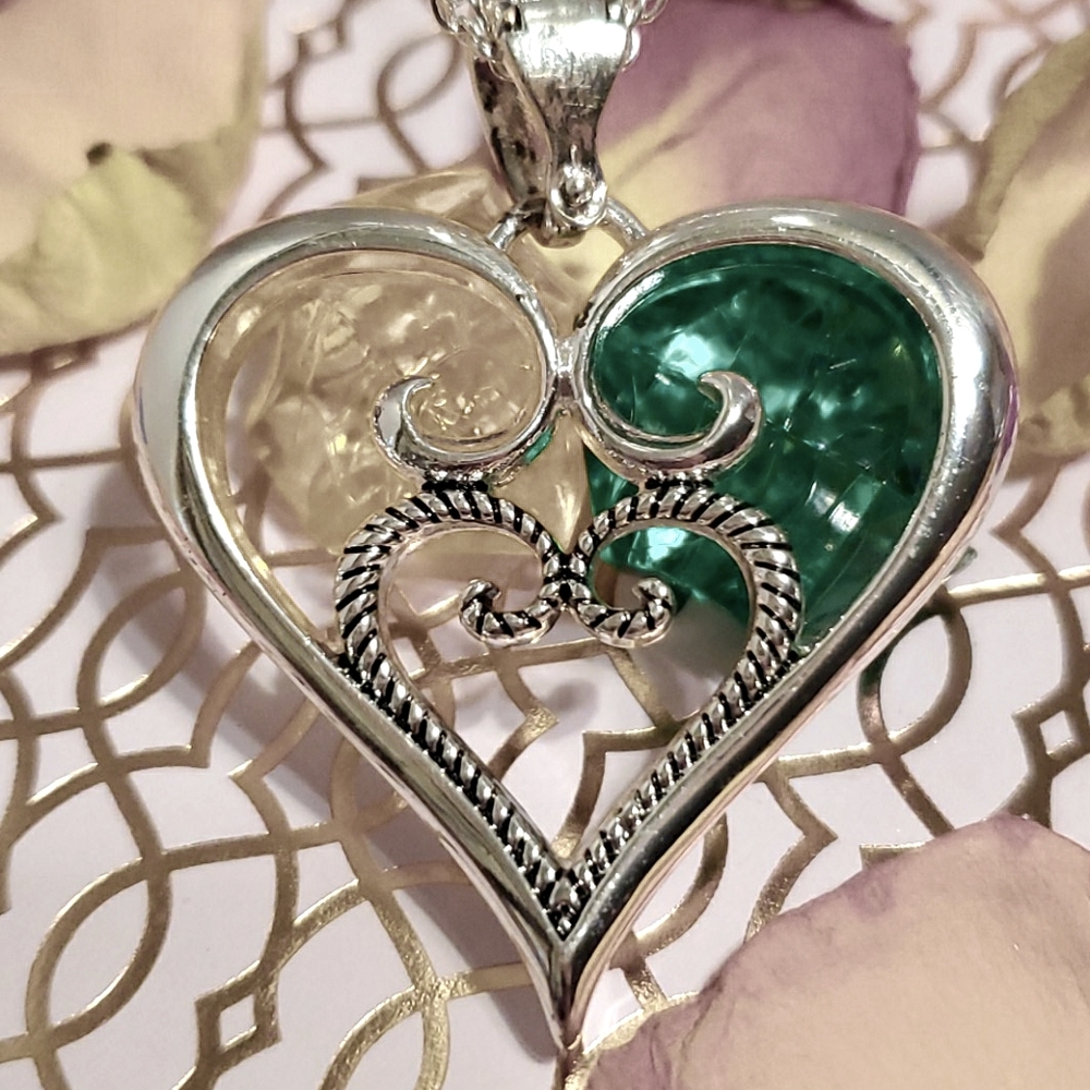 Sterling Silver necklace and heart.